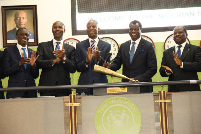  L – R: Mr. Kunle Ayodeji, Executive Director, Finance & Operations, Computer Warehouse Group (CWG Plc); Mr. Phillip Obioha, Chief Operating Officer, CWG Plc; Mr. Ade Bajomo, Executive Director, Market Operations and Technology, NSE; Mr. Austin Okere, Chief Executive Officer, CWG Plc; and Mr. James Agada, Chief Technology Officer, CWG Plc at the Closing Gong Ceremony at the Nigerian Stock Exchange (NSE).