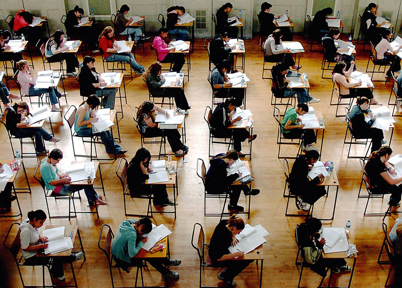 File photo dated 10/06/05 of school exams in progress. PRESS ASSOCIATION Photo. Issue date: Monday January 5, 2009. The education gap between children from England's richest and poorest areas is widening, according to official figures obtained by the Conservatives. In 2007, the proportion of children achieving five good GCSEs, including English and maths, in schools where more than half of the pupils were eligible for free school meals was 13%, a drop from 14% in 2006. See PA story EDUCATION Gap. Photo credit should read: Rui Vieira/PA Wire